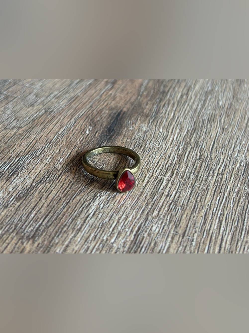 Fashion Jewelry Women’s size 10.5 brass tone pear shape red stone bezel ring